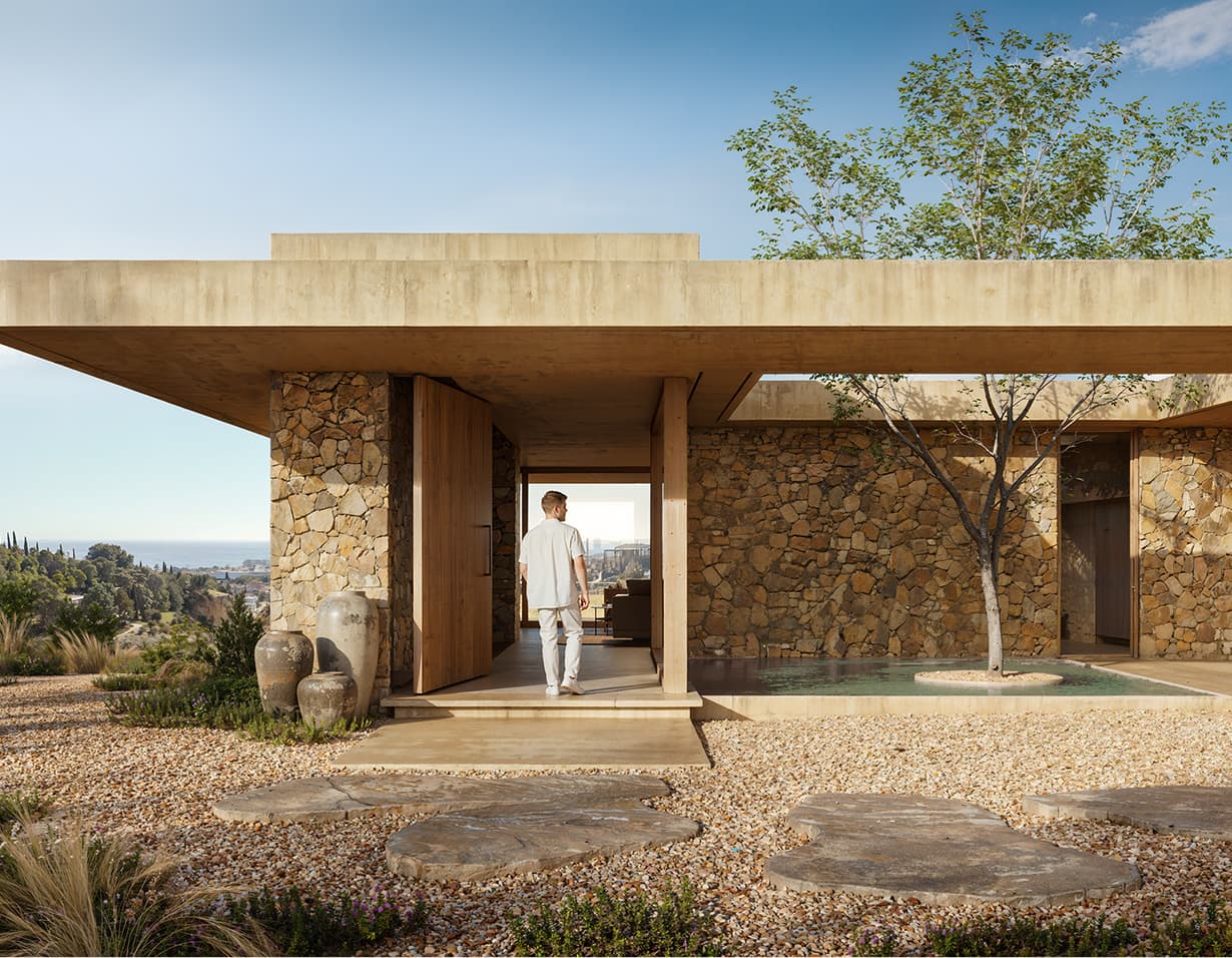 Stone villa entrance with reflecting pool